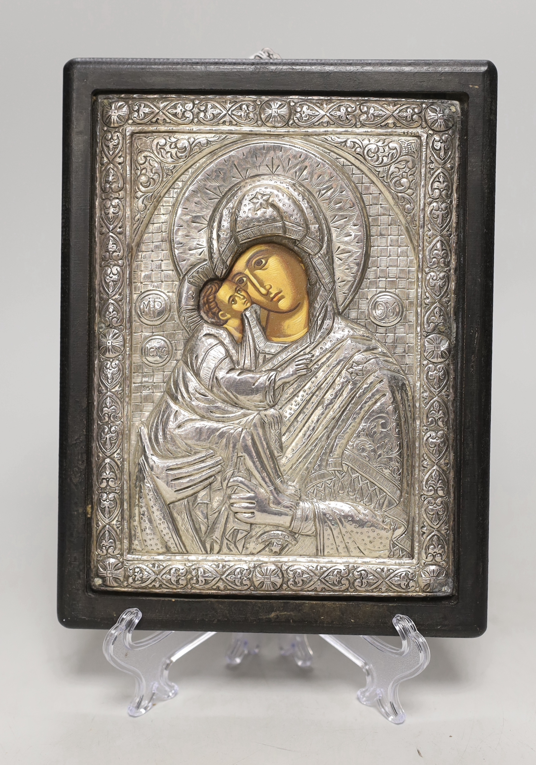 A white metal overlaid Greek or Russian icon, 24 x 18cm including frame